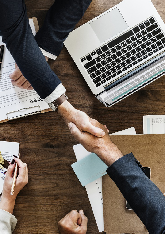 Business people shaking hands together